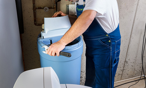 Man installing a water softener