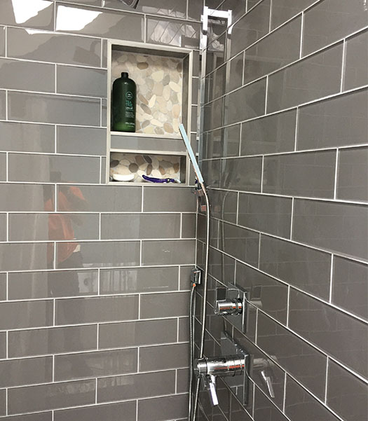 Finished Gray-tiled shower installation